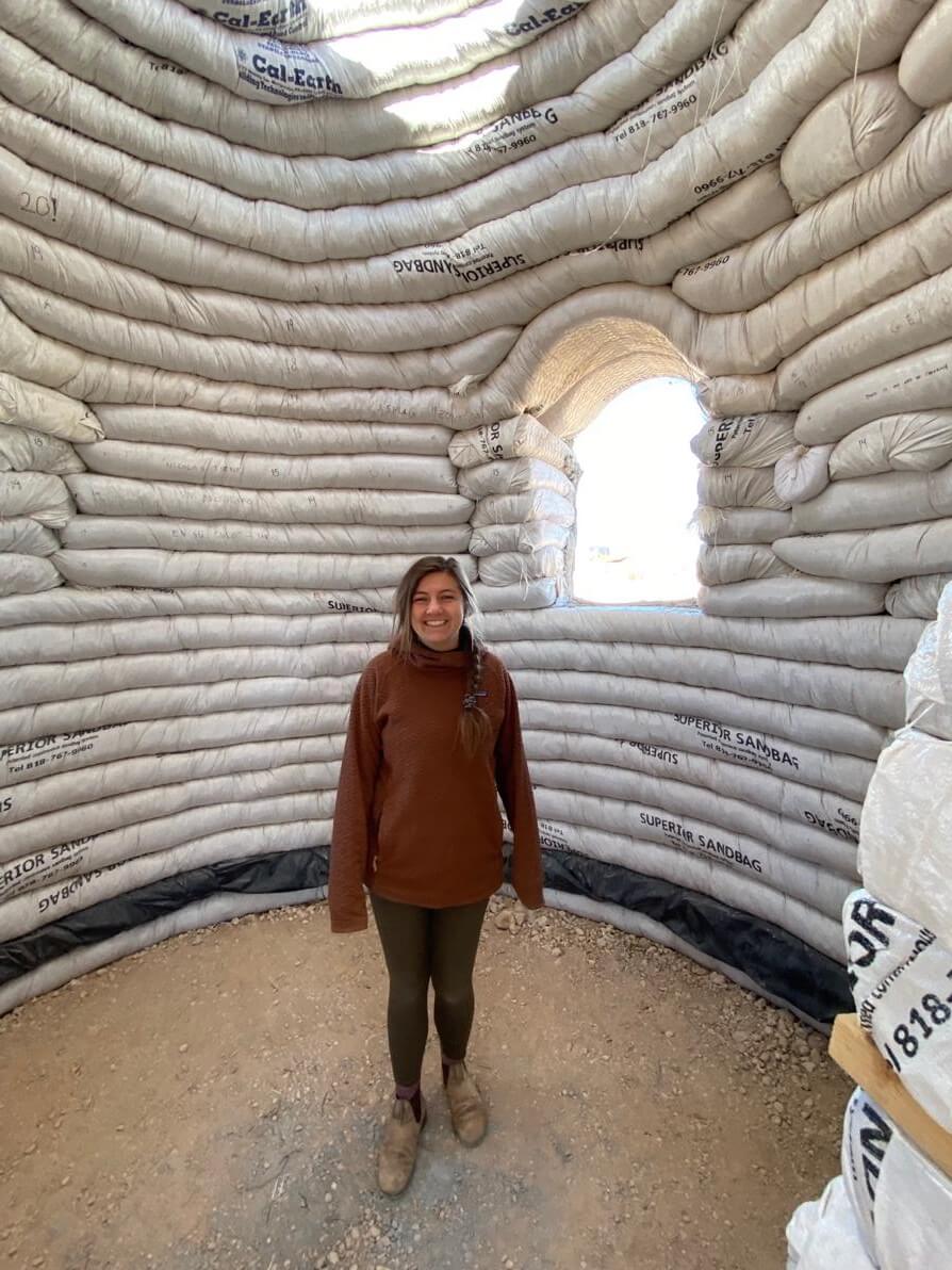 Nicolette inside a bag house at The Mojave Center, a sustainable community located two blocks from the farm.